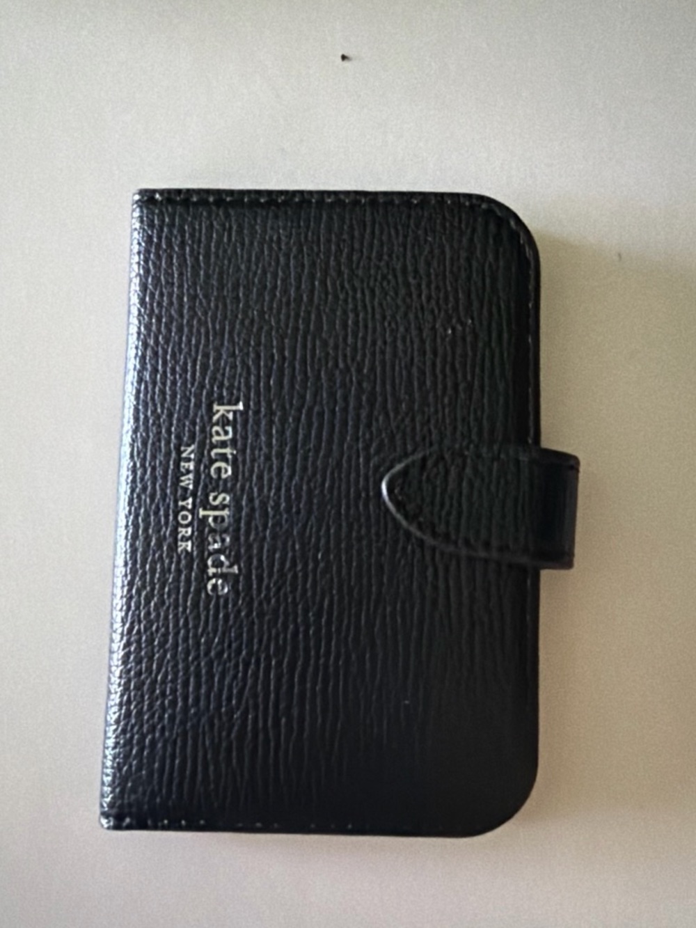 kate spade black leather MagSafe card case with snap closure